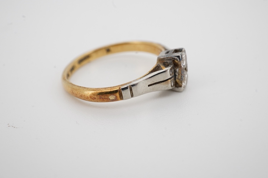 An Art Deco 18ct, plat and two stone diamond set ring, size K, gross weight 2.5 grams. Condition - fair to good